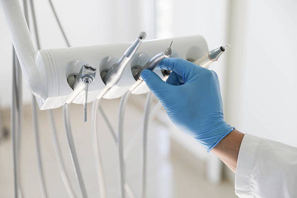 Professional Tooth Extraction technician working in North Syracuse, NY